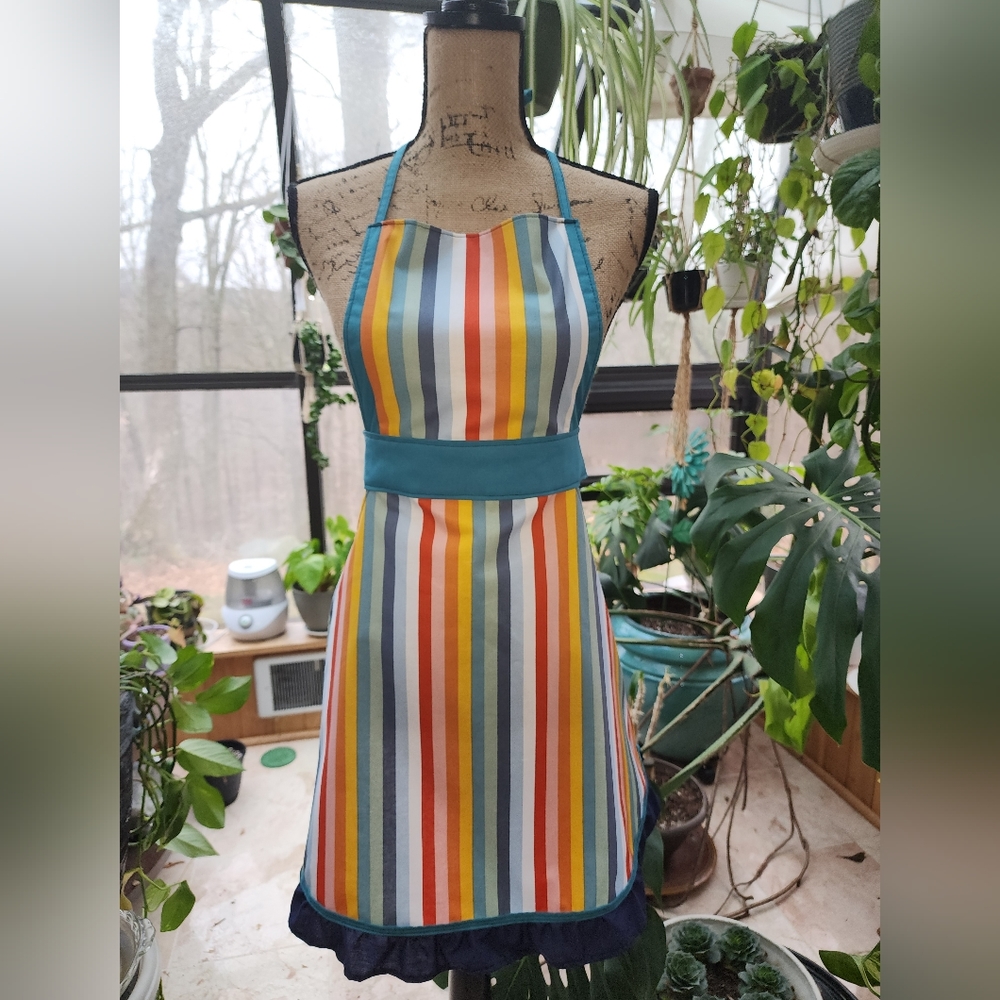 Handmade, one of a kind, apron. Made with fine cotton and durable threading.